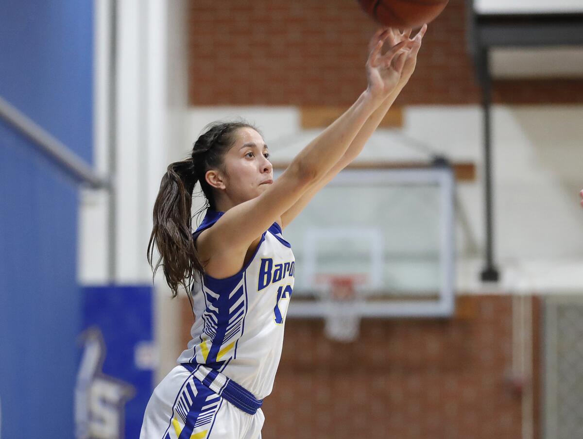 Fountain Valley's Margaret Tengan (12) sinks a three-point basket late in the game against Corona del Mar on Jan. 31.