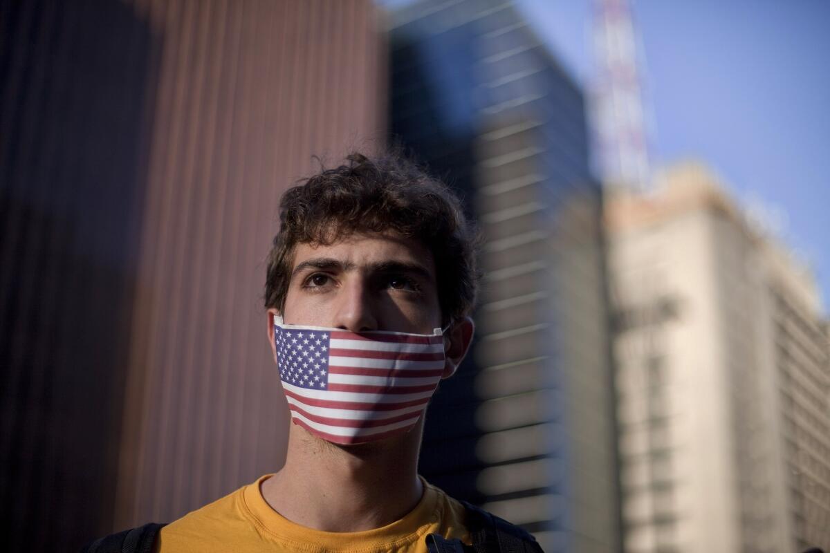 A protester in Sao Paulo, Brazil, takes part in a demonstration against the country's rejection of Edward Snowden's asylum application.