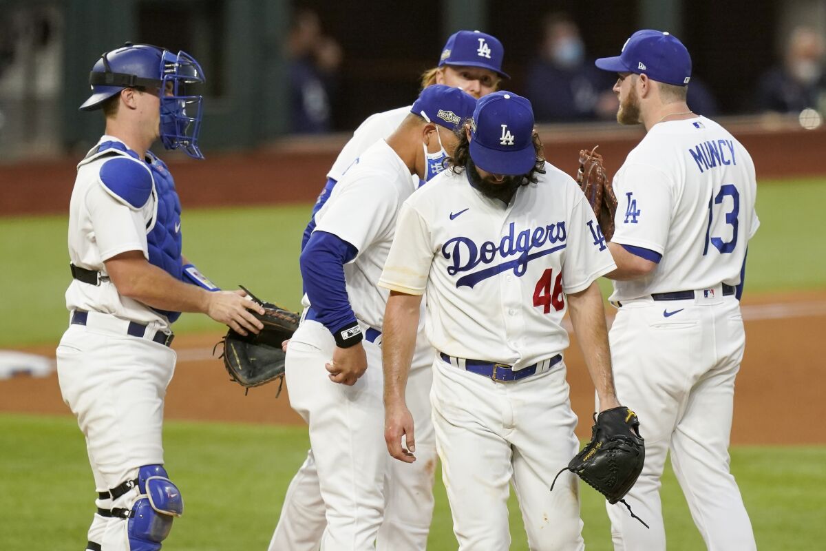 Dodgers starting pitcher Tony Gonsolin exits during the fifth inning of Game 2.