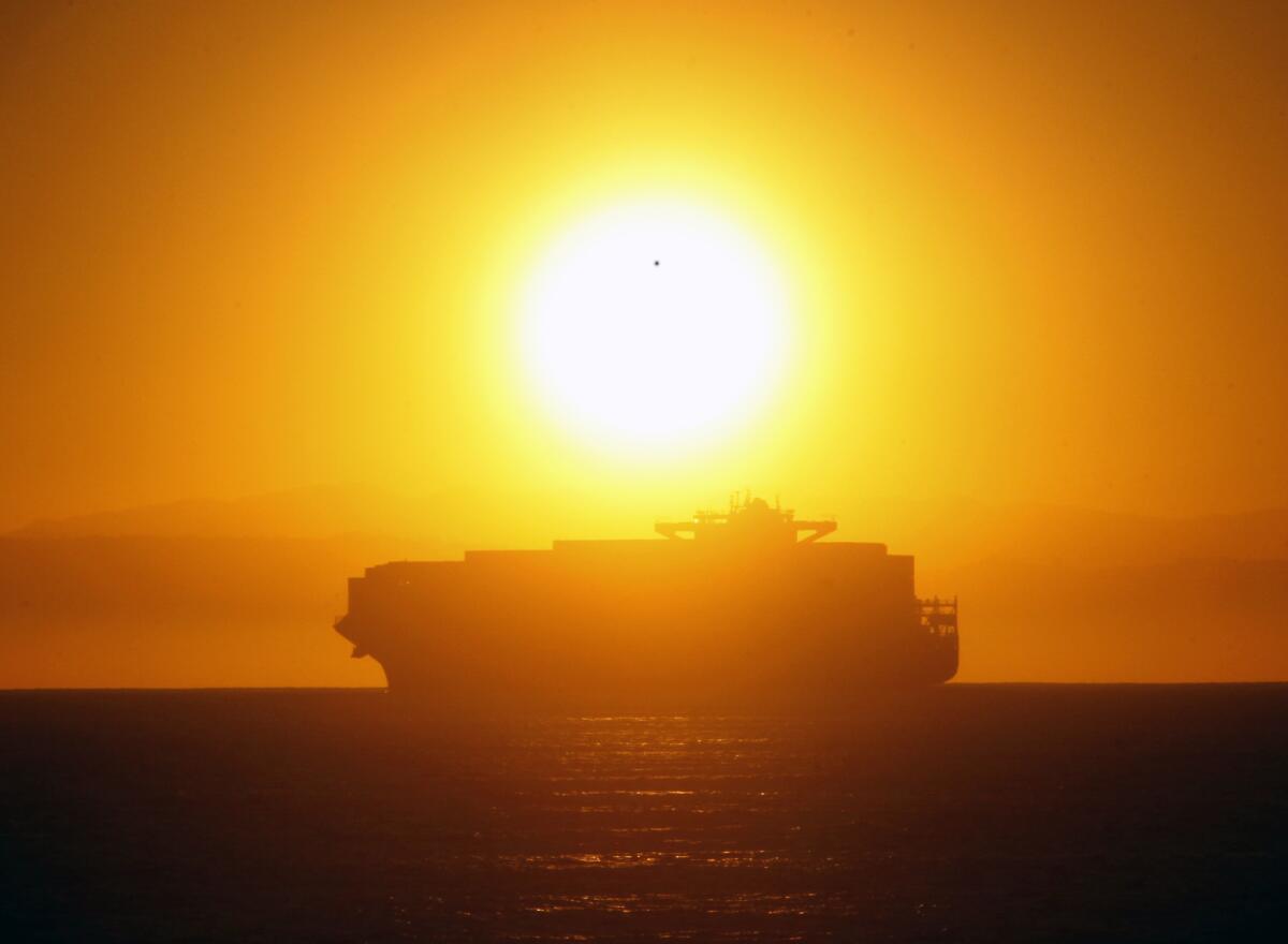 A container ship waits to get into the Port of Long Beach on Wednesday.