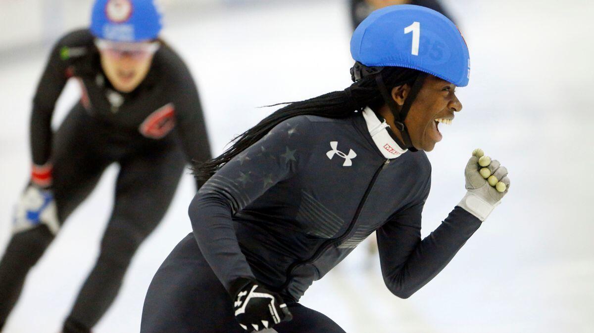 Maame Biney celebrates after winning the women's 500-meter final A during the U.S. Olympic short track speedskating trials in Kearns, Utah on Dec. 16, 2017. Biney is the first black female skater to make a U.S. short track Olympic team.