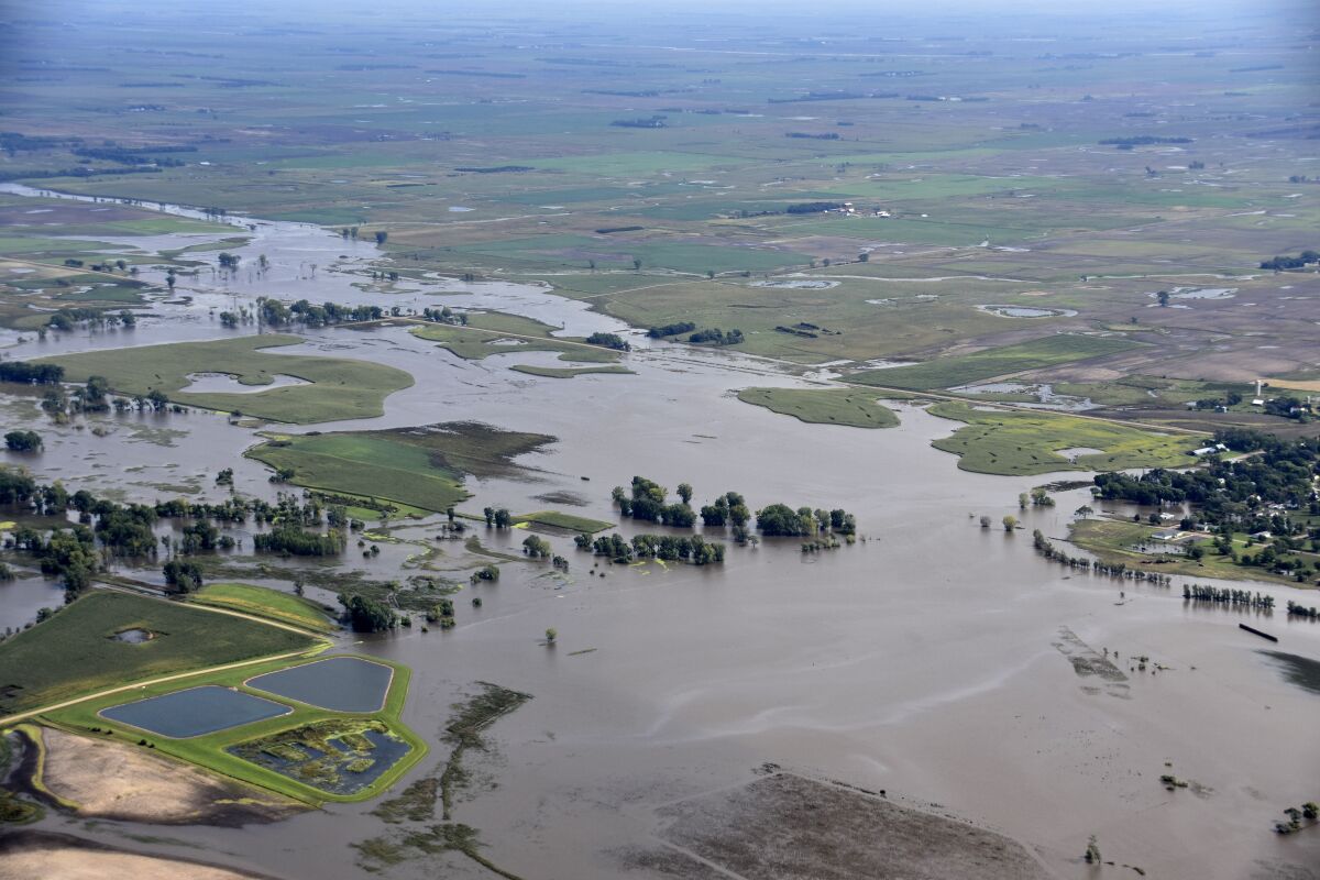 This Saturday, Sept. 14, 2019 photo provided by the South Dakota Civil Air Patrol shows an aerial view of the flooding in Spencer, S.D. Flooding from torrential rain that's soaked much of southeastern South Dakota has closed schools for a second day, submerged city streets and caused some to evacuate their homes. (South Dakota Civil Air Patrol via AP)
