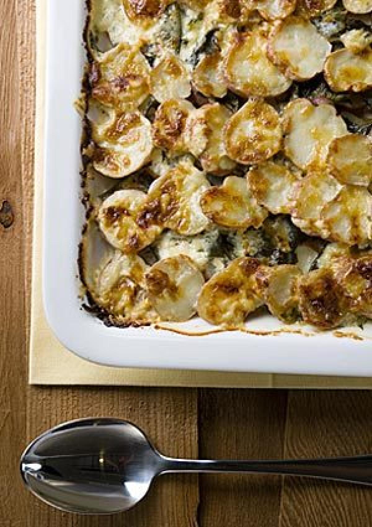 FROM THE GROUND UP: New potato and dandelion gratin is a spring variation on the winter standard.