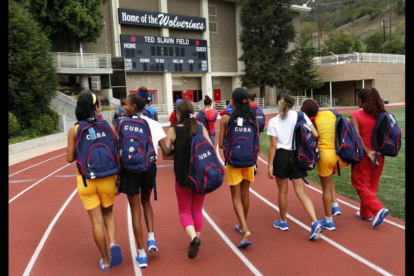 Members of the Cuban delegation to the Special Olympics arrive at Harvard-Westlake High School in Studio City for a practice session on July 22. The Cuban delegation consists of 16 athletes and coaches.