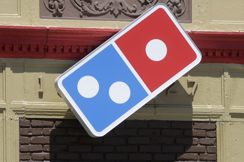 FILE - In this July 15, 2019 file photo shows a Domino's location in Norwood, Mass. Domino’s Pizza CEO Ritch Allison announced his retirement Tuesday, March 1, 2022, the same day the company announced weaker-than-expected fourth quarter earnings. (AP Photo/Steven Senne, File)