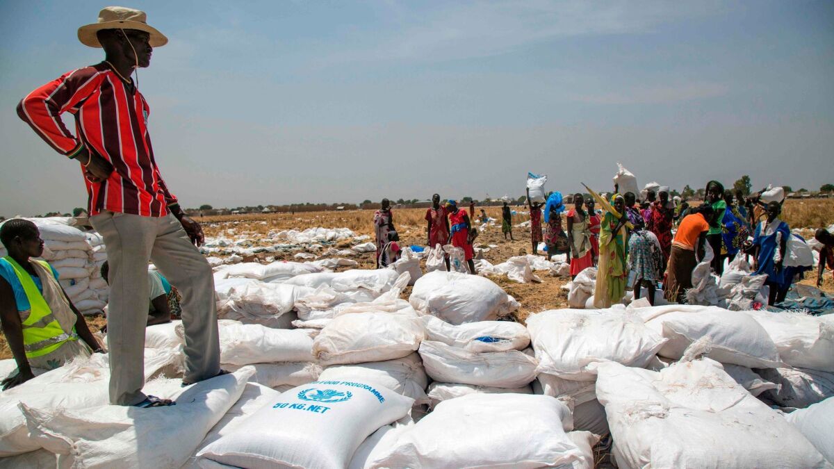 A community leader supervises a World Food Program distribution on March 4, 2017, in Ganyiel, South Sudan.