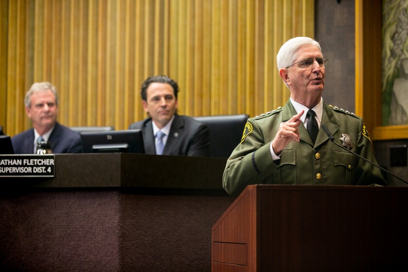 Sheriff Bill Gore spoke at a podium in front of county supervisors in 2019
