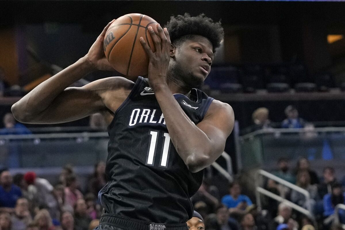 Orlando Magic's Mo Bamba grabs a rebound against the Oklahoma City Thunder.