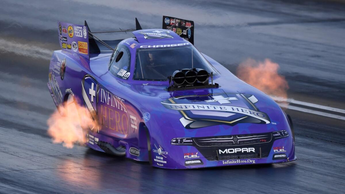 Jack Beckman races to the Funny Car preliminary top qualifying position at the annual Auto Club NHRA Finals. Beckman raced to a 3.835-second pass at 334.98 mph in his Infinite Hero Foundation Dodge Charger R/T to earn the top spot.