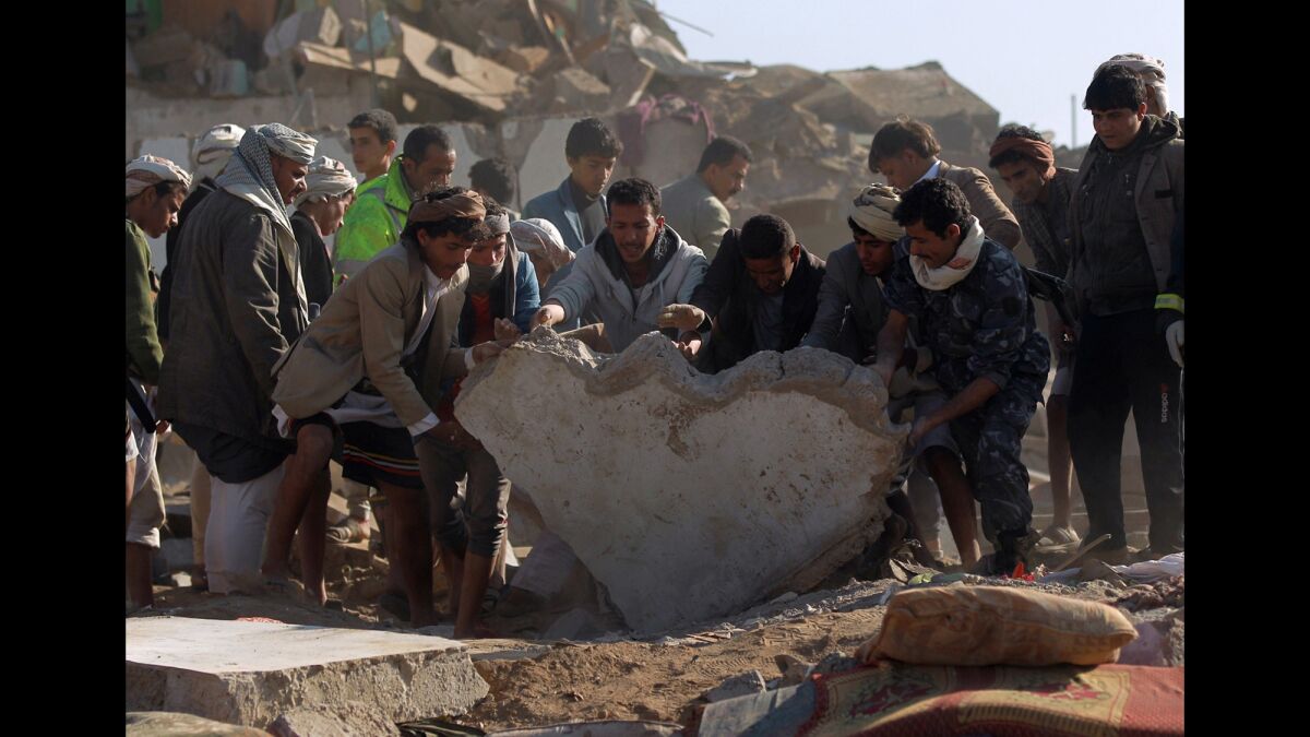 The search for survivors in the rubble of buildings destroyed during Saudi airstrikes near Sana Airport on March 26.