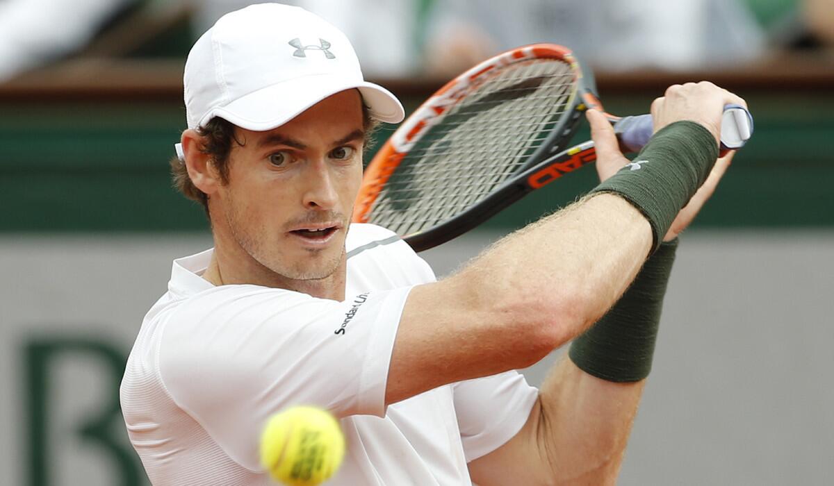 Andy Murray returns a serve in his second round match of the French Open tennis tournament against Mathias Bourgue on Wednesday.