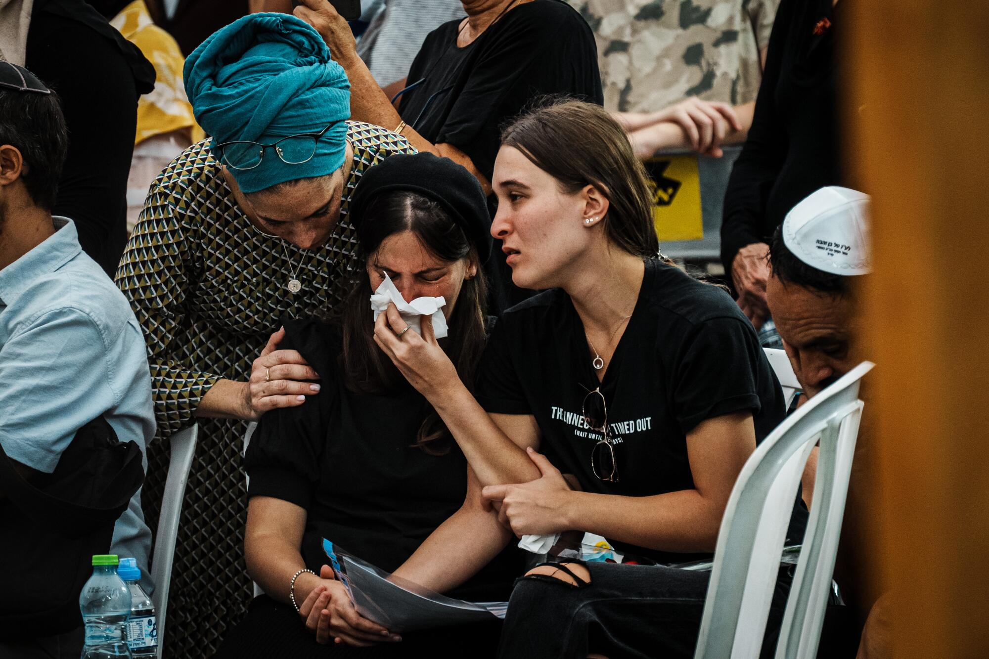 Family members mourn during the funeral of an Israeli soldier at the Mount Herzl cemetery in Jerusalem.