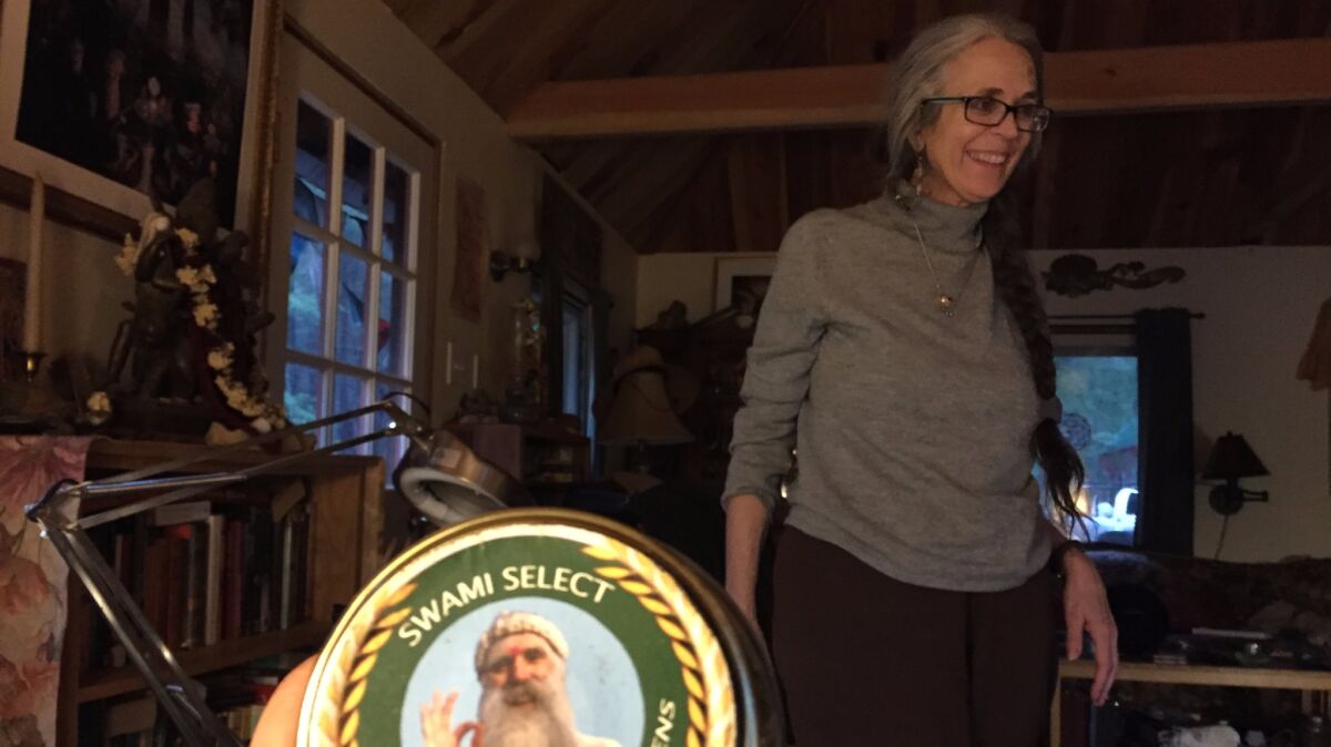Nikki Lastreto, in background, with a distinctive Swami Select label in foreground