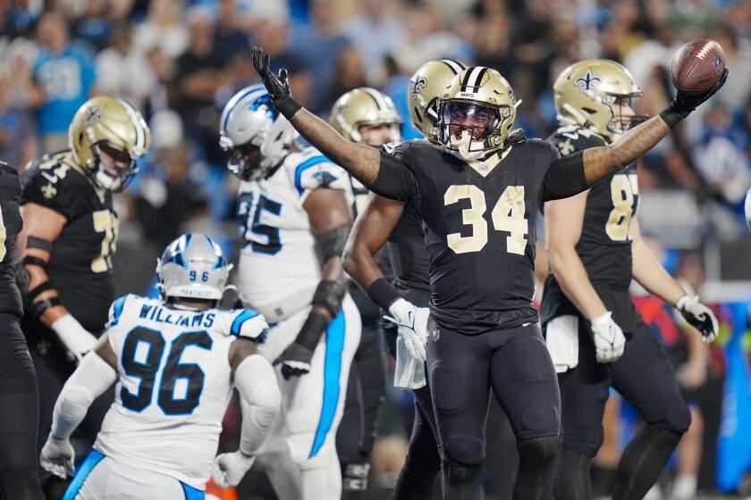 New Orleans Saints running back Tony Jones Jr. celebrates after scoring against the Carolina Panthers during the second half of an NFL football game Monday, Sept. 18, 2023, in Charlotte, N.C. (AP Photo/Rusty Jones)