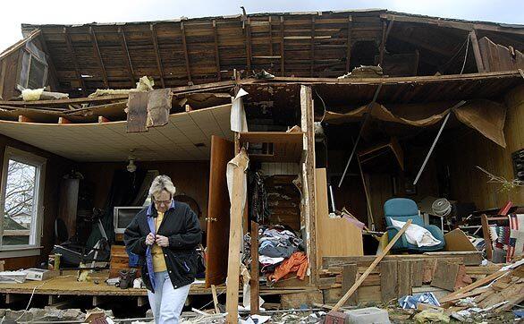 Anne Gibson is among the residents in Mena, Ark., whose homes were hit by a tornado. The twister killed three people, injured at least 24 and flattened homes and businesses, including a manufacturing plant.