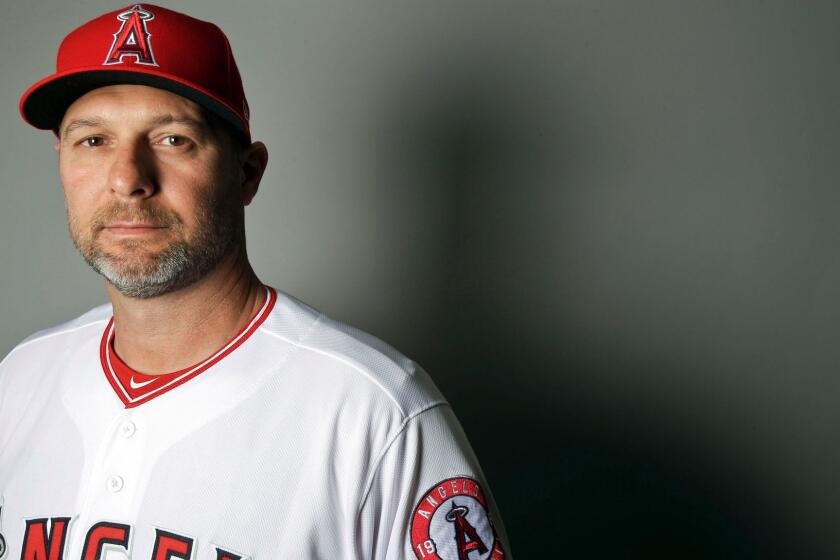 FILE - In this 2017 file photo, Los Angeles hitting coach Dave Hansen poses for a portrait. Hansen will not return next season, the Angels announced Wednesday, Oct. 4, 2017, three days after finishing 80-82 and missing the postseason for the third straight year. (AP Photo/Chris Carlson, File)