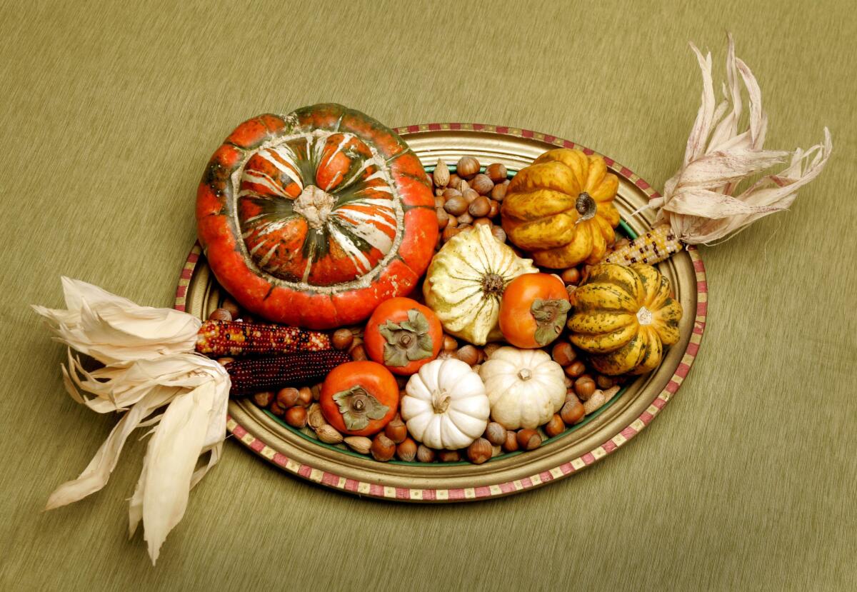 On Thanksgiving, keep the centerpieces low so guests can easily see and talk with one another across the table.