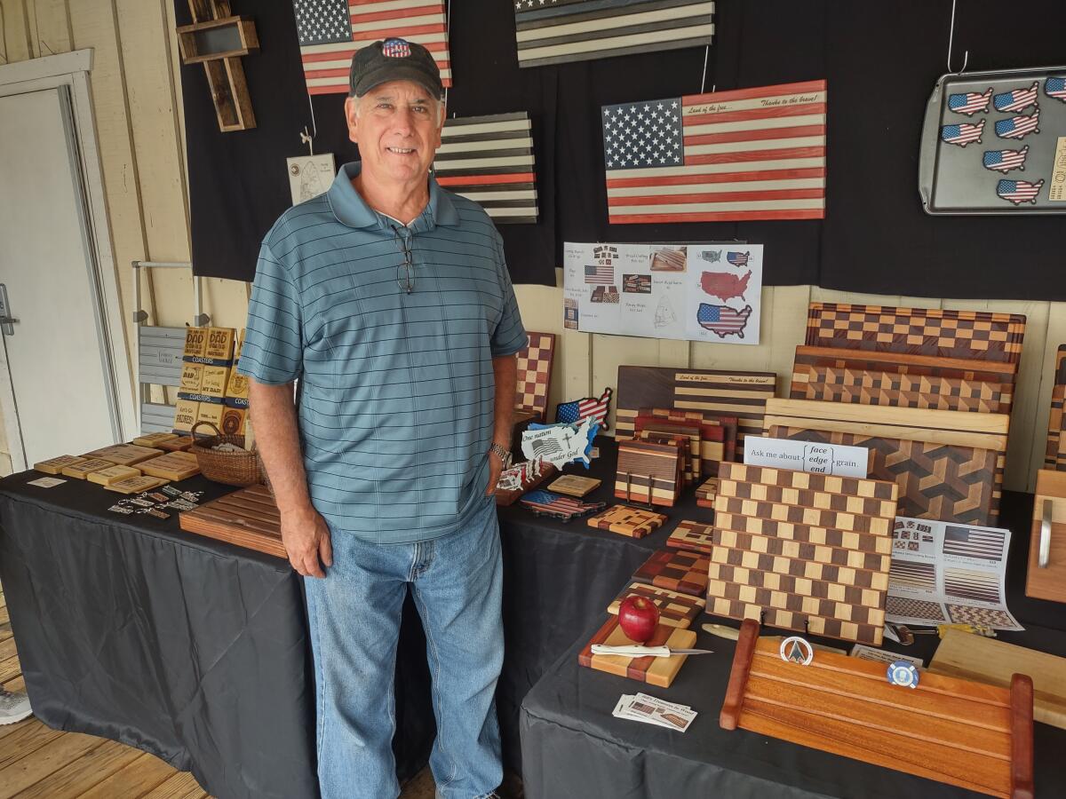 Bill Stevener sells woodworking items such as cutting boards and chess boards and wife, Sandy, sells macrame plant hangers.
