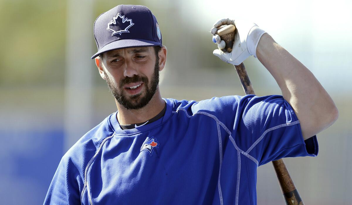 Toronto Blue Jays' Chris Colabello loosens up before a spring training baseball game against the New York Mets in Dunedin, Fla. on March 23.