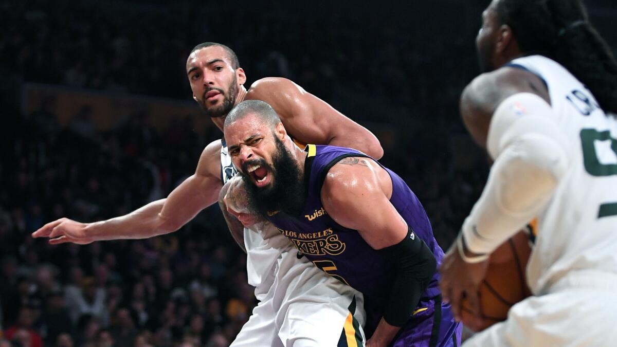 The Lakers' Tyson Chandler and Jazz's Rudy Gobert battle for position as Jae Crowder drives to the basket.