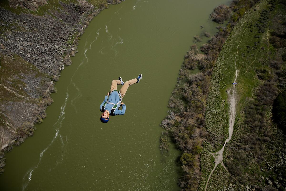 A base jumper leaps from the Perrine Bridge above the Snake River, where one can jump without a permit.