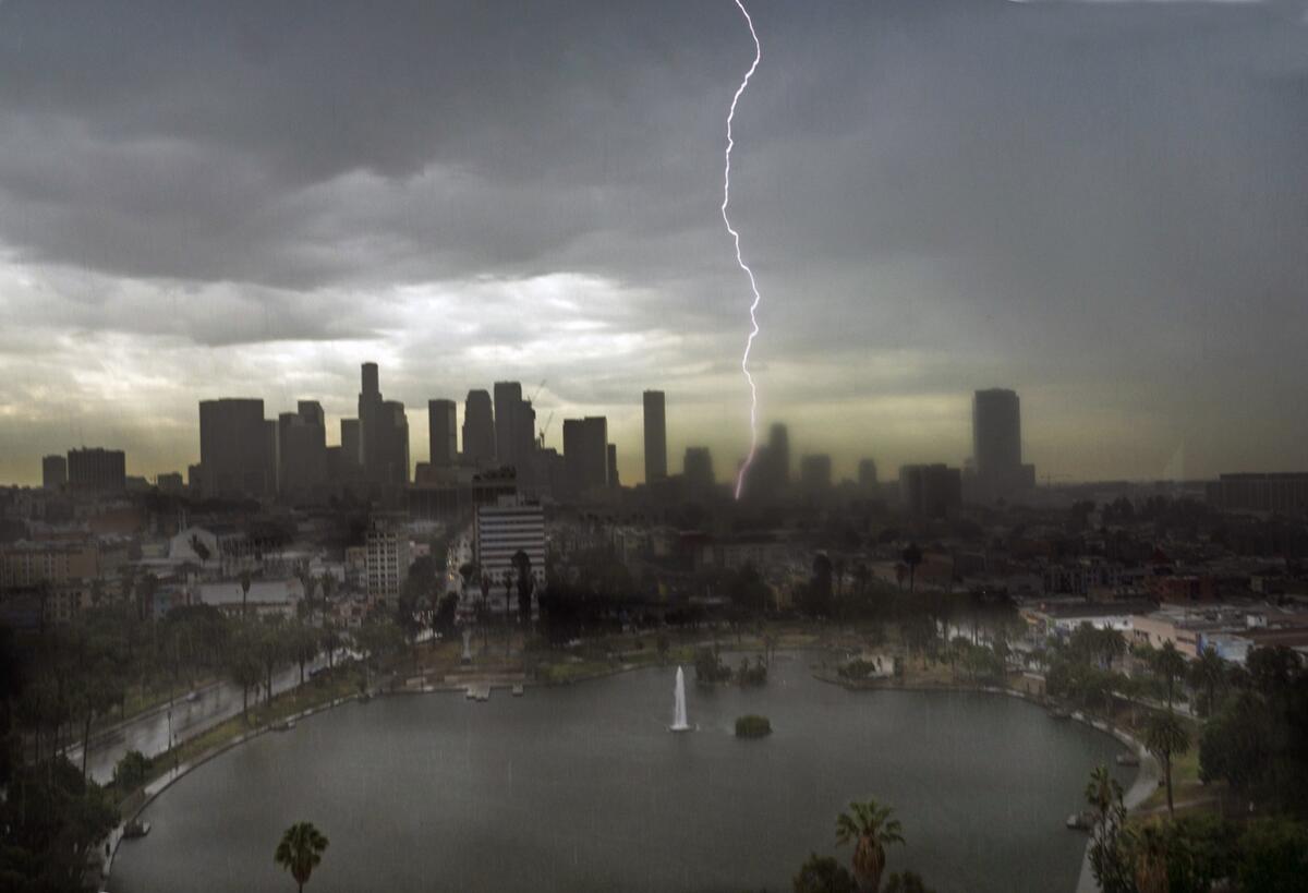 Lightning splits the sky over downtown Los Angeles July 18, 2015. More storms could be ahead in the coming days.