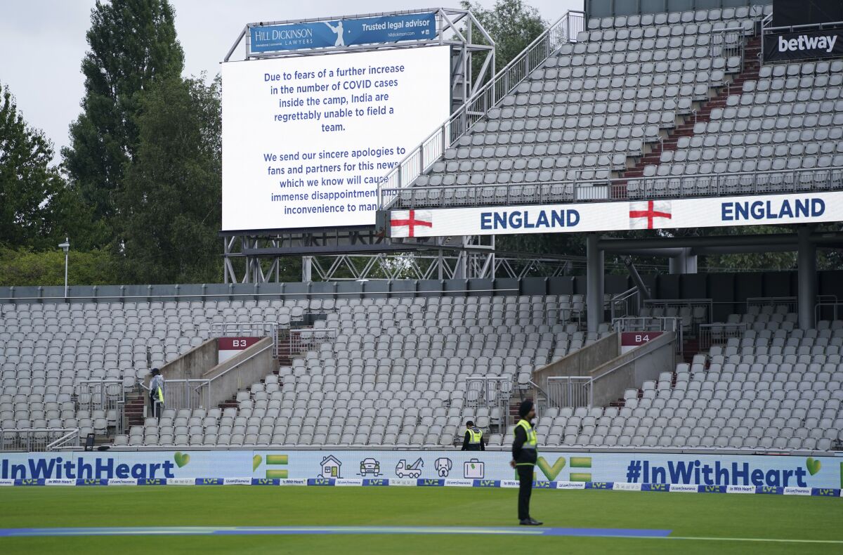 A message is displayed on a screen at Old Trafford cricket ground after fifth and final cricket test match between England and India was canceled in Manchester, England, Friday, Sept. 10, 2021. The fifth and final test of the cricket series between England and India was canceled on Friday barely two hours before play was due to start in Manchester, following a coronavirus outbreak in the India camp. (AP Photo/Jon Super)