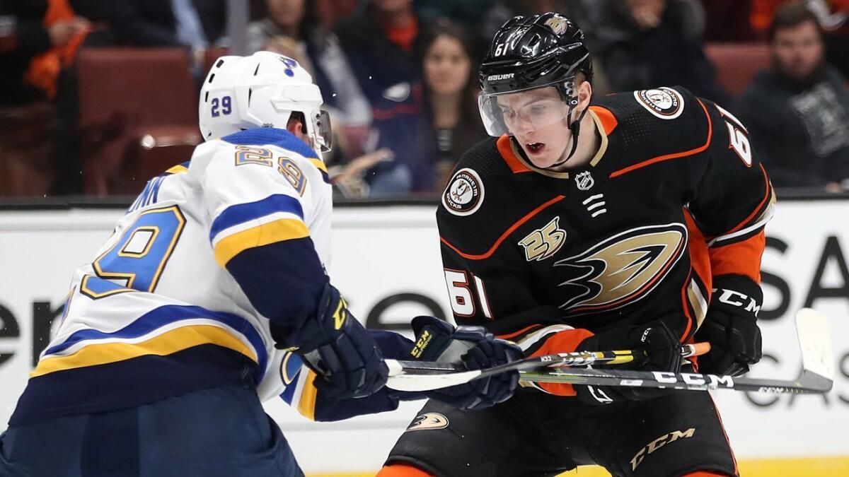 Ducks rookie Troy Terry, right, tries to get past St. Louis defender Vince Dunn on March 6 at Honda Center.