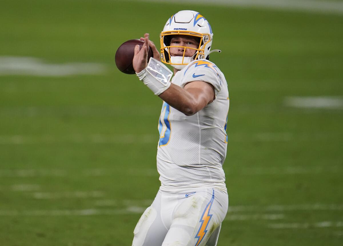 Chargers quarterback Justin Herbert throws a pass