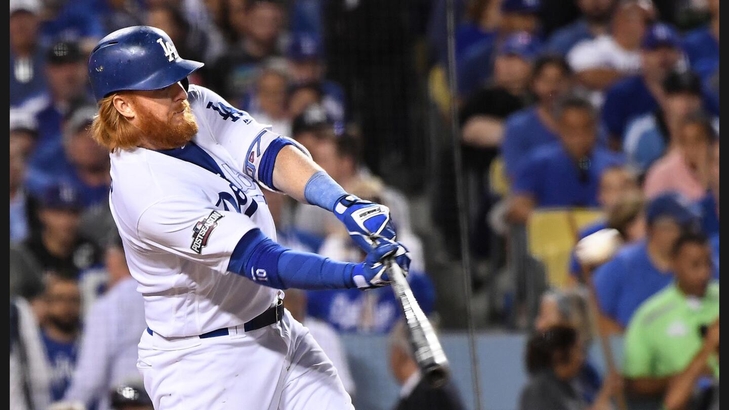 Dodgers' Justin Turner hits a solo home run against Cubs pitcher Jake Arrieta in the sixth inning in Game 3 of the NLCS at Dodger Stadium.
