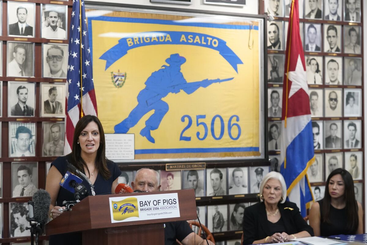 Florida Lt. Gov. Jeanette Nunez, left, speaks at a news conference along with Cuban exiles, of their concern of the sale of two local Spanish language radio stations, Wednesday, June 8, 2022, at the Bay of Pigs Museum and Brigade 2506 headquarters in Miami's Little Havana neighborhood. Cuban exiles describe it as a clear attempt by Democrats to stifle conservative and anti-Communist voices in a Hispanic community where they've lost ground. (AP Photo/Wilfredo Lee)