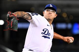 Los Angeles, California October 4 2022-Dodgers pitcher Julio Urias throws a pitch.