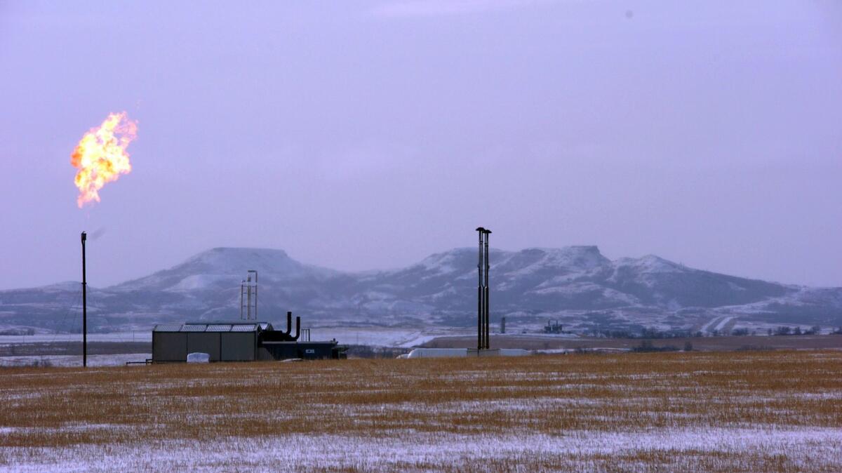 A gas flare at a natural gas processing facility near Williston, N.D.