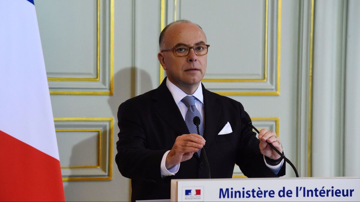French Interior Minister Bernard Cazeneuve prepares to speak at a news conference on Monday in Paris.