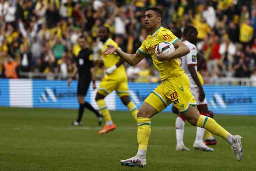 FILE - Nantes' Mostafa Mohamed celebrates after scoring his side's opening goal during the French League One soccer match between Nantes and Monaco in Nantes, France, Sunday, April 9, 2023. French soccer club Nantes fined striker Mostafa Mohamed for refusing to play against Toulouse on Sunday, when teams across the country wore rainbow-colored numbers on their jerseys this weekend to support the fight against homophobia. (AP Photo/Jeremias Gonzalez, File)