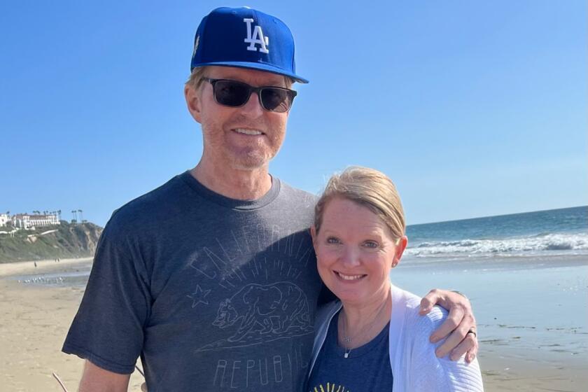 Todd Sand and wife Jenni Meno on the beach.