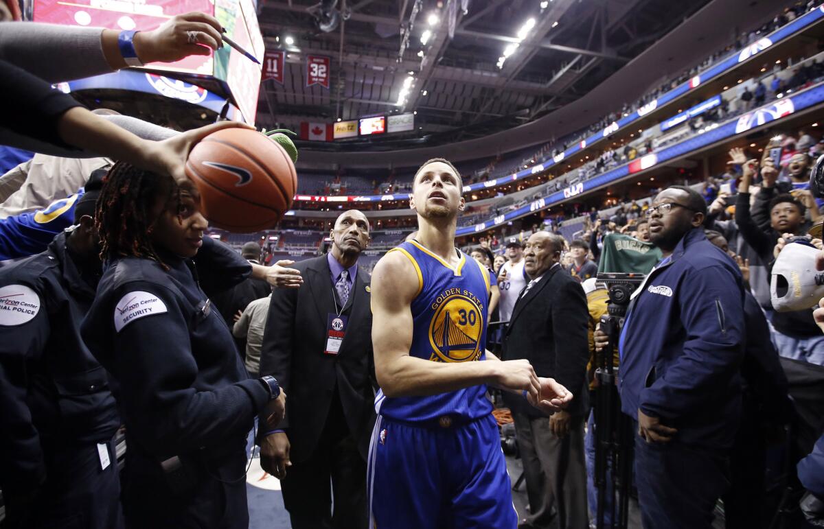 Stephen Curry comes off the court after the Warriors' 134-121 victory over the Wizards on Feb. 3.