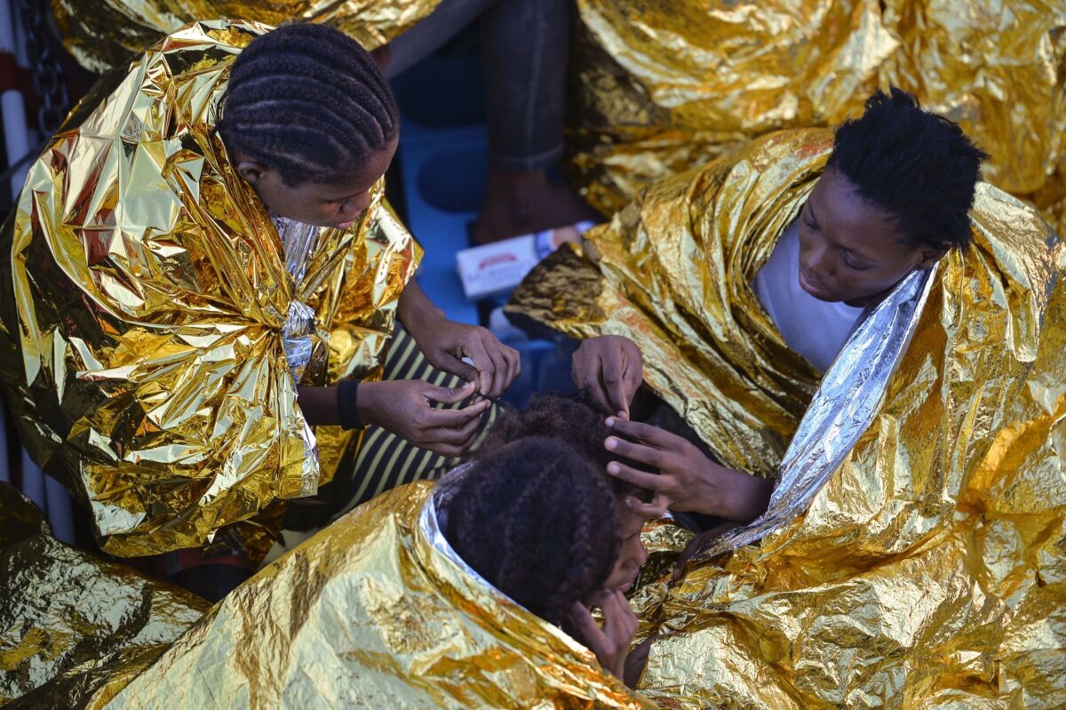 African women aboard the Topaz Responder run by the Maltese organization Migrant Offshore Aid Station and the Red Cross after a rescue operation off the Libyan coast in the Mediterranean Sea on Nov. 3.