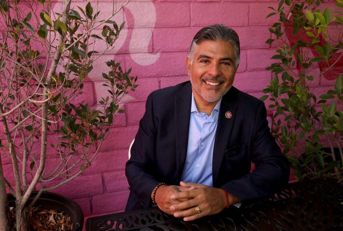 Rep. Tony Cárdenas smiles in a dark jacket and blue shirt.