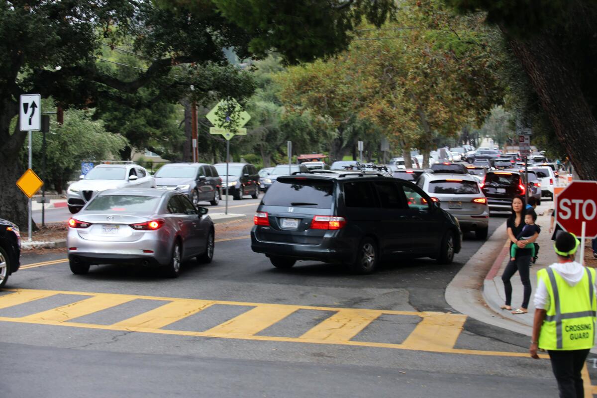 Motorists are stuck in traffic at the corner of Gould Avenue and Knight Way trying to drop off their child at school at Paradise Canyon Elementary School on a recent morning. The La Cañada Flintridge Public Works Department has been trying to make improvements at the Knight Way and Gould Avenue intersection and has called a town hall meeting for Monday, Nov. 4 at 6:30 p.m. in the school's multipurpose room.