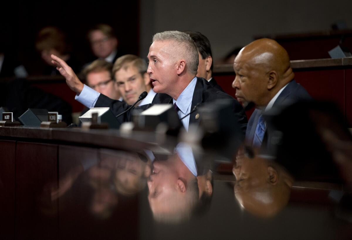 House Select Committee on Benghazi chairman Rep. Trey Gowdy (R-S.C.), second from right, joined by ranking member Elijah Cummings (D-Md.), right, gestures as he speaks on Capitol Hill in Washington on Wednesday.