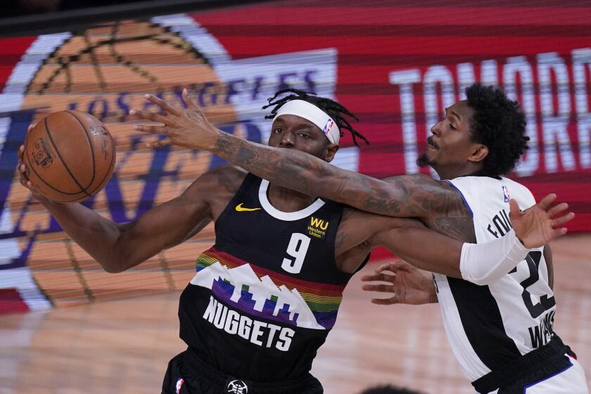 Denver Nuggets' Jerami Grant (9) is defended by Los Angeles Clippers' Lou Williams (23) during the first half of an NBA conference semifinal playoff basketball game, Wednesday, Sept. 9, 2020, in Lake Buena Vista, Fla. (AP Photo/Mark J. Terrill)