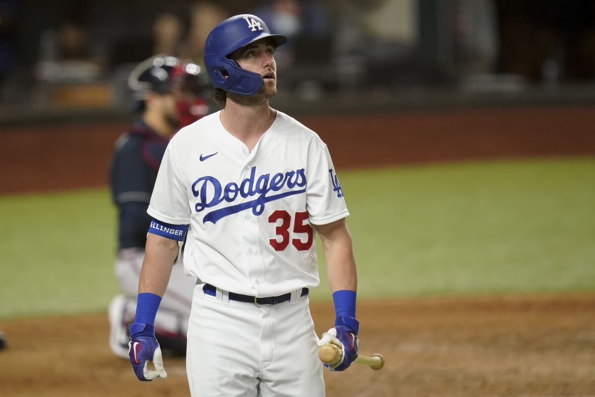 Dodgers center fielder Cody Bellinger walks back to the dugout after striking out against the Atlanta Braves.