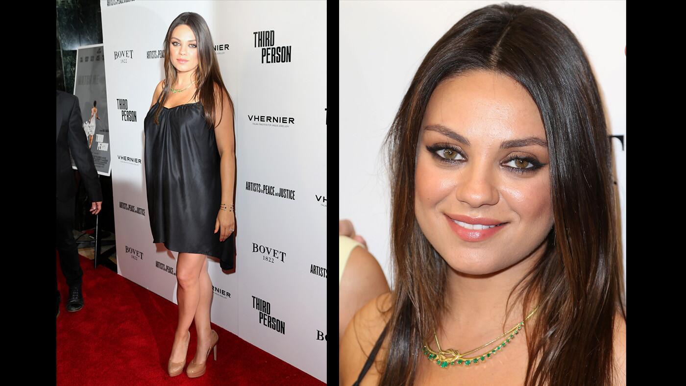Several months pregnant, Mila Kunis wears a little black maternity dress to the premiere of "Third Person" in 2014.