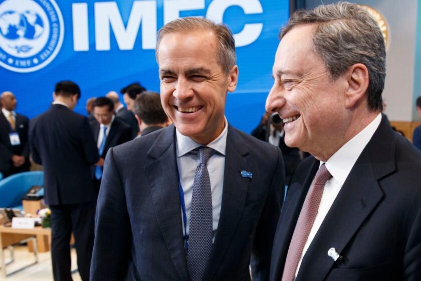 Mandatory Credit: Photo by SHAWN THEW/EPA-EFE/REX (10203396i) President of the European Central Bank Mario Draghi (R) talks with Governor of the Bank of England Mark Carney (L), prior to the IMFC meeting at IMF headquarters in Washington, DC, USA, 13 April 2019. International Monetary Fund World Bank Group Spring Meetings runs from 09 - 13 April 2019. International Monetary Fund World Bank Group Spring Meetings 2019, Washington, USA - 13 Apr 2019 ** Usable by LA, CT and MoD ONLY **