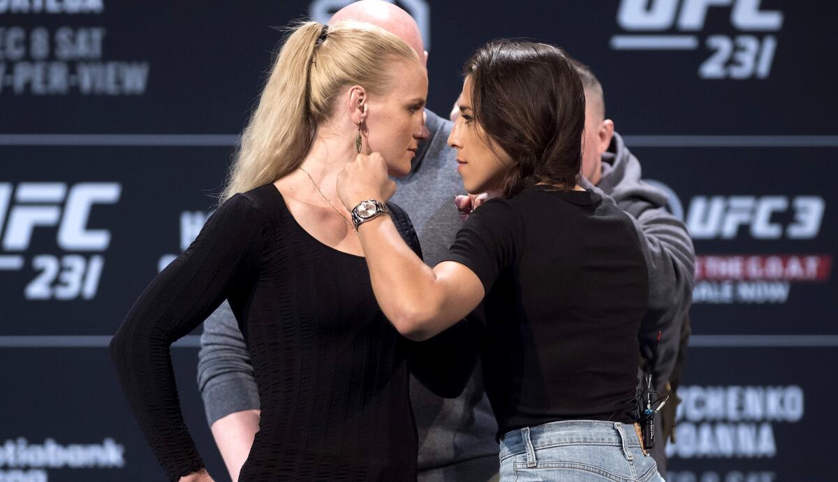 Valentina Shevchenko, left, and Joanna Jedrzejczyk face off at a news conference in Toronto on Wednesday.