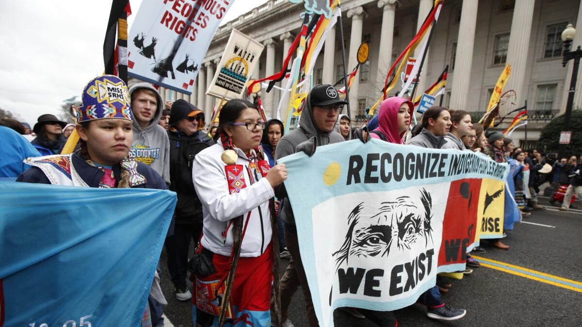 Native Americans and their supporters march toward the White House on March 10, 2017, in protest of the Dakota Access oil pipeline.