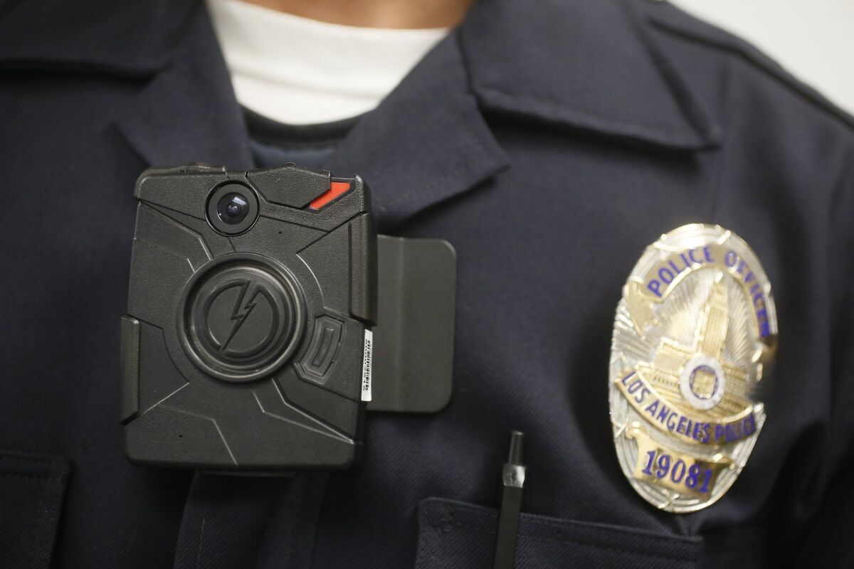 A Los Angeles Police officer wears an on-body camera during a demonstration for media in Los Angeles.
