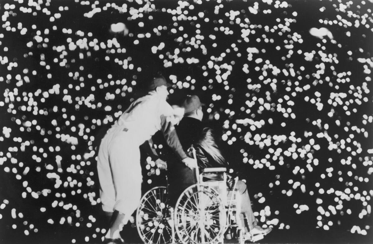 A sea of lights in a blacked out Coliseum during a tribute to Dodgers legend Roy Campanella on May 7, 1959.