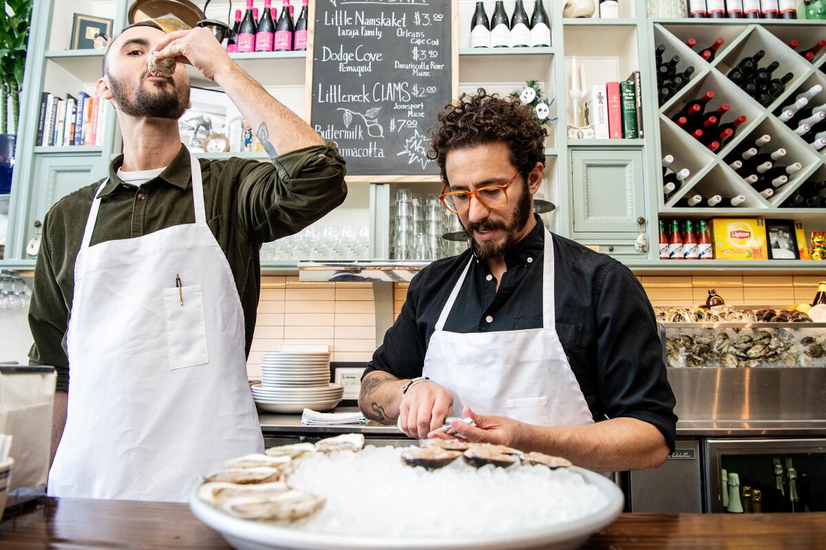 General manager Joe Laraja, left, and chef and co-owner Ari Kolender behind the counter at Found Oyster.